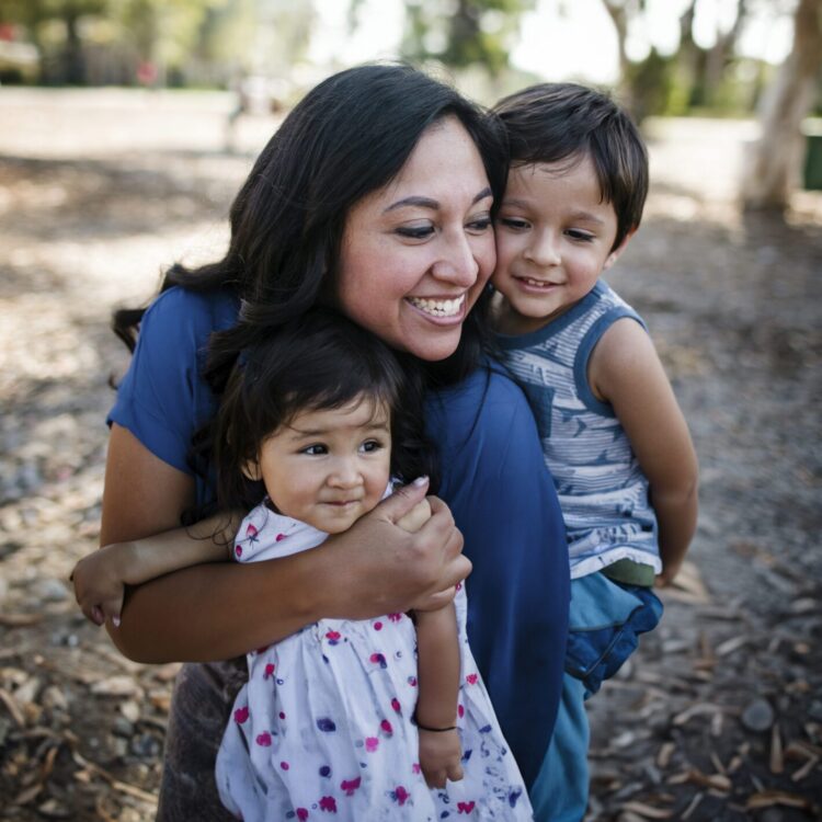 happy-mother-playing-with-children-at-park-3